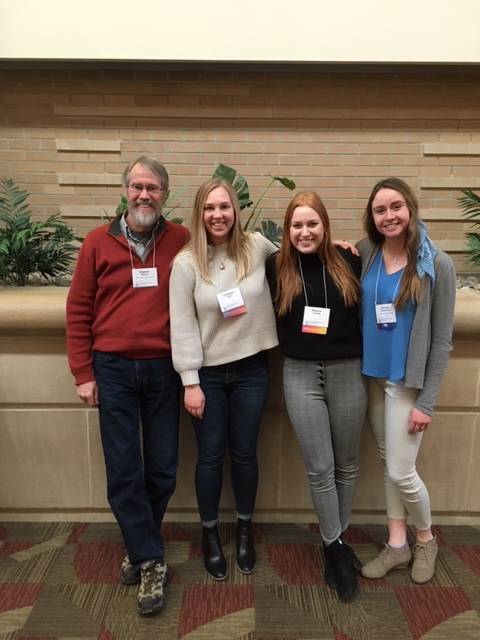 Hannah with Faculty and friends and the Outstanding Major awards